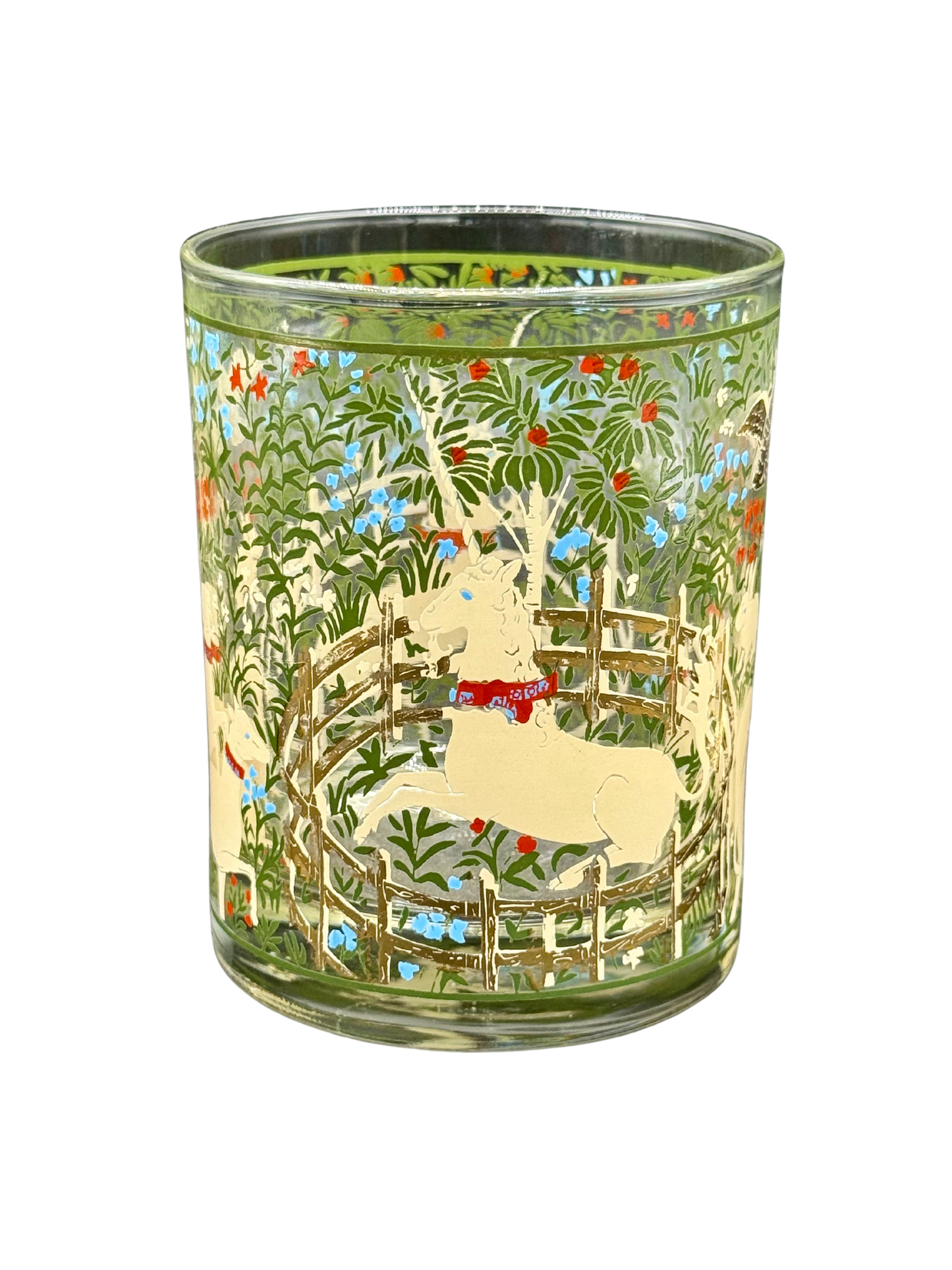 Close-up of unicorn tumbler with floral background and gold fence, midcentury Marc Cora design