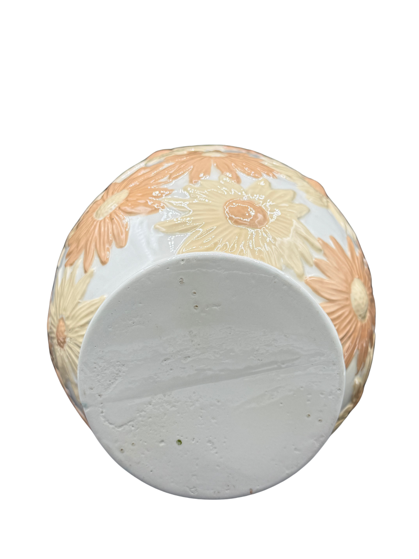 Bottom base of vintage floral vase showing unmarked ceramic surface.