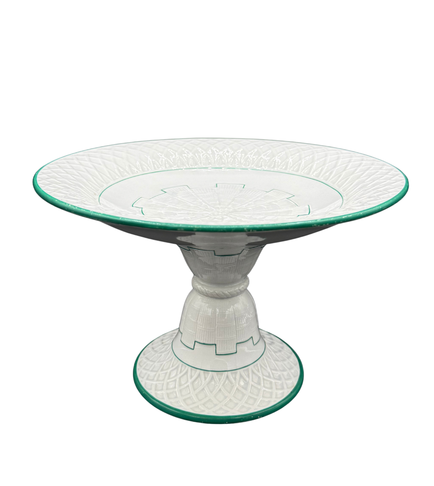 Side angle of Minton green-trimmed ceramic tazza with raised pedestal and molded lattice design