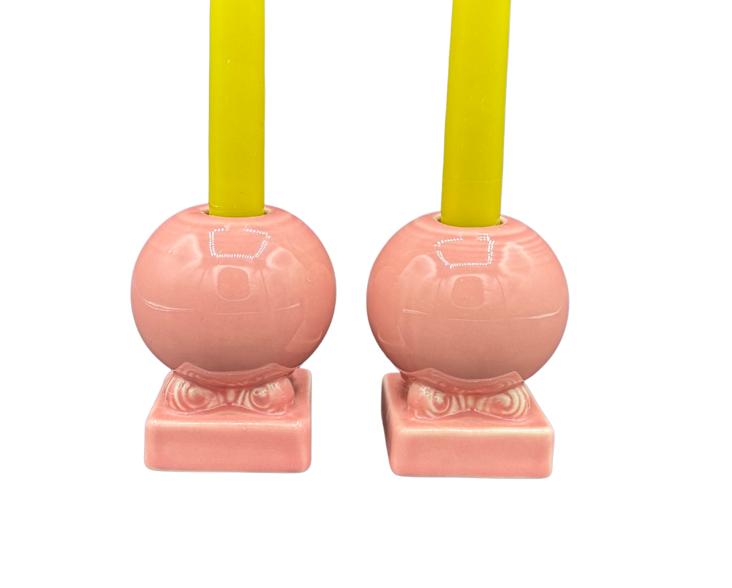 Close-up of Fiestaware pink ceramic globe candle holders, vintage midcentury design
