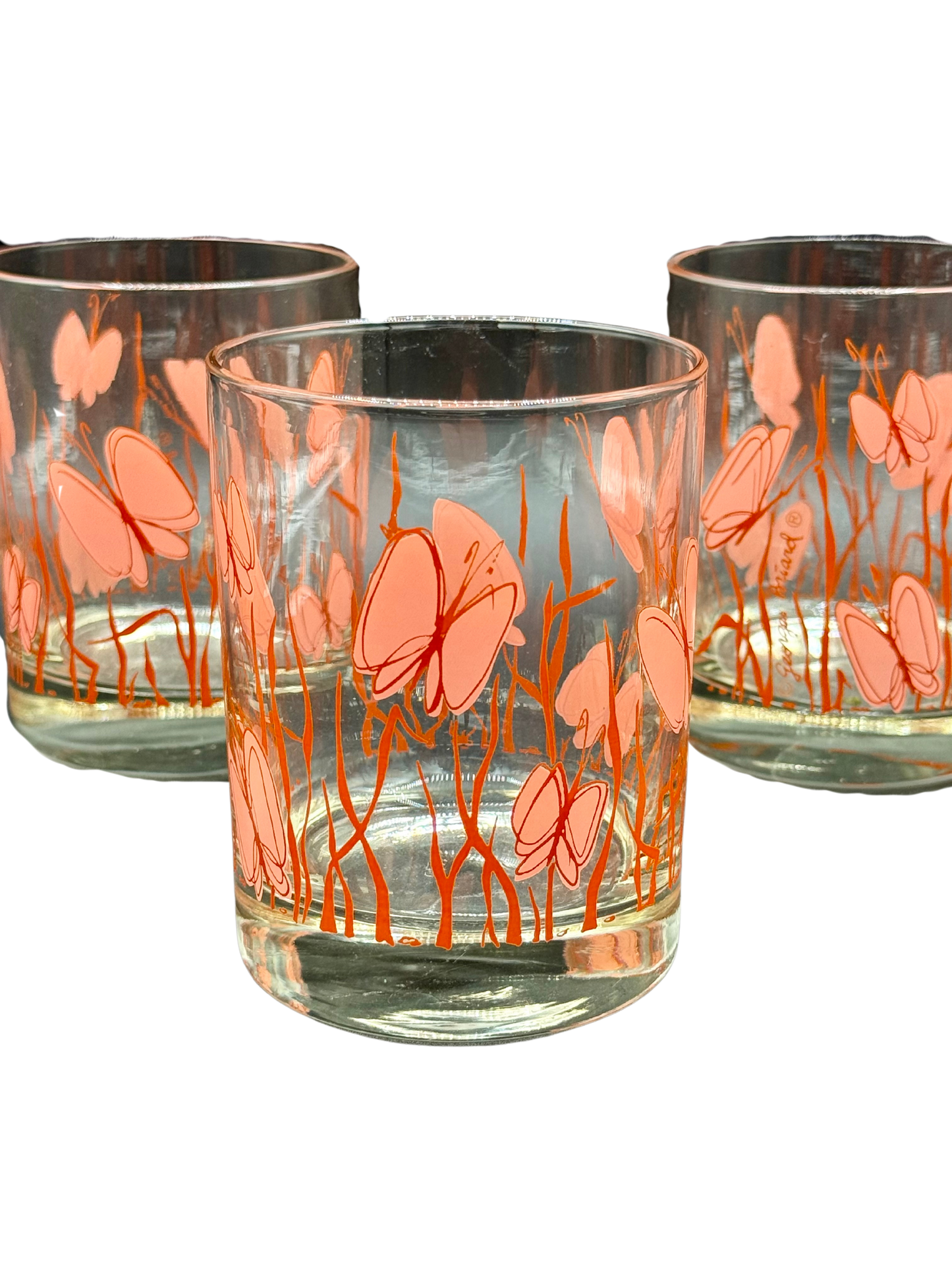 Group of Georges Briard glasses with butterfly motif and signature visible