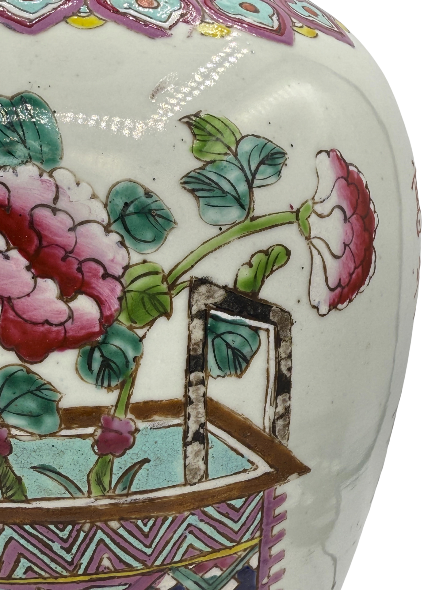 Close-up of Famille Rose brushwork showing hand-painted peonies and patterned basket on vintage Chinese ginger jar lamp