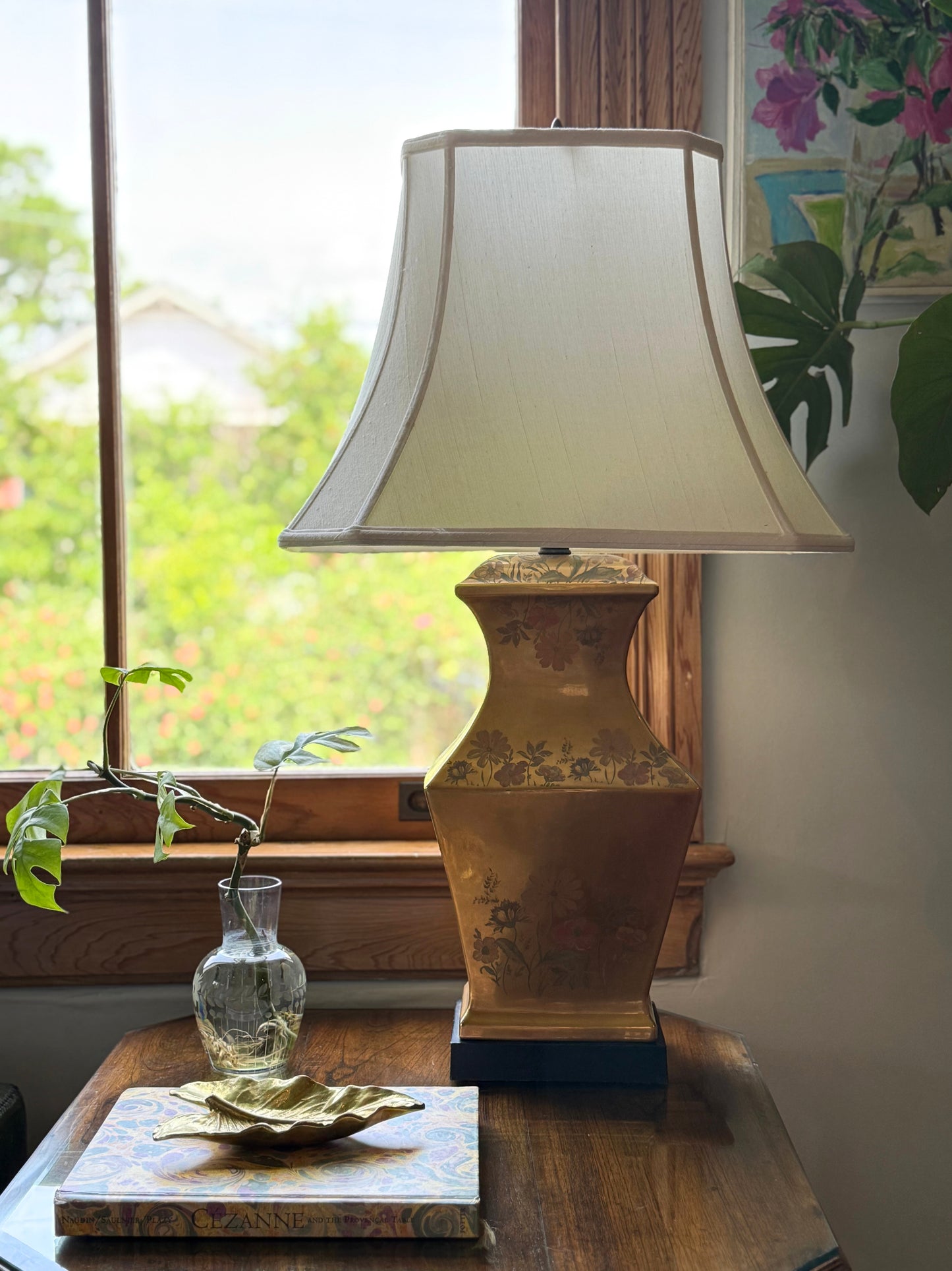 Vintage Morris Greenspan Hollywood Regency lamp with white shade styled on a wood side table near window