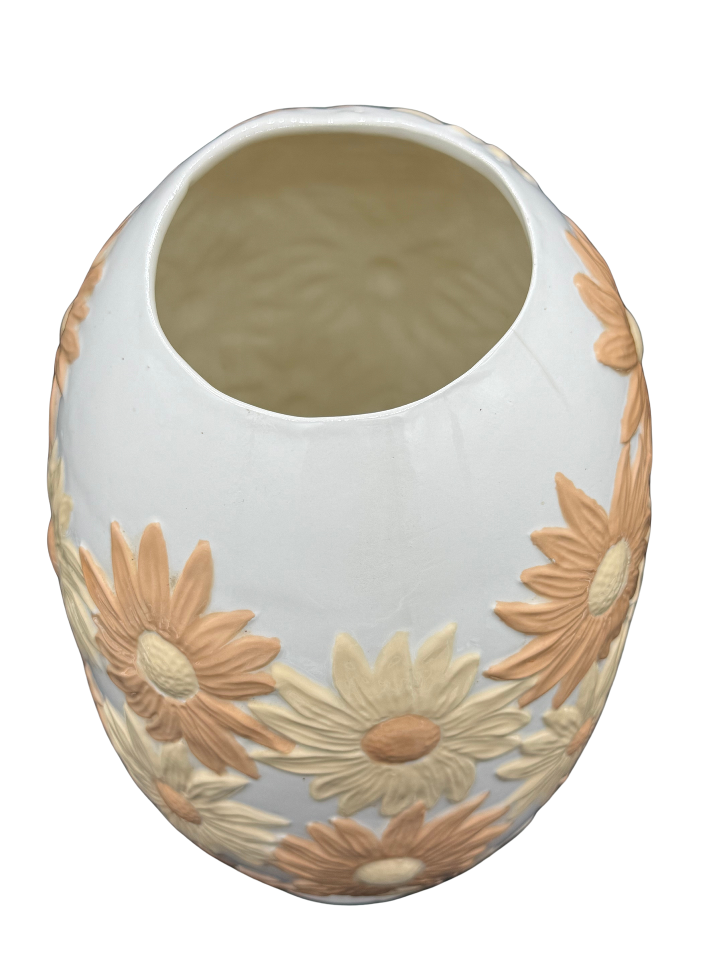Top-down view of open floral ceramic vase with sculpted rim and interior detail.