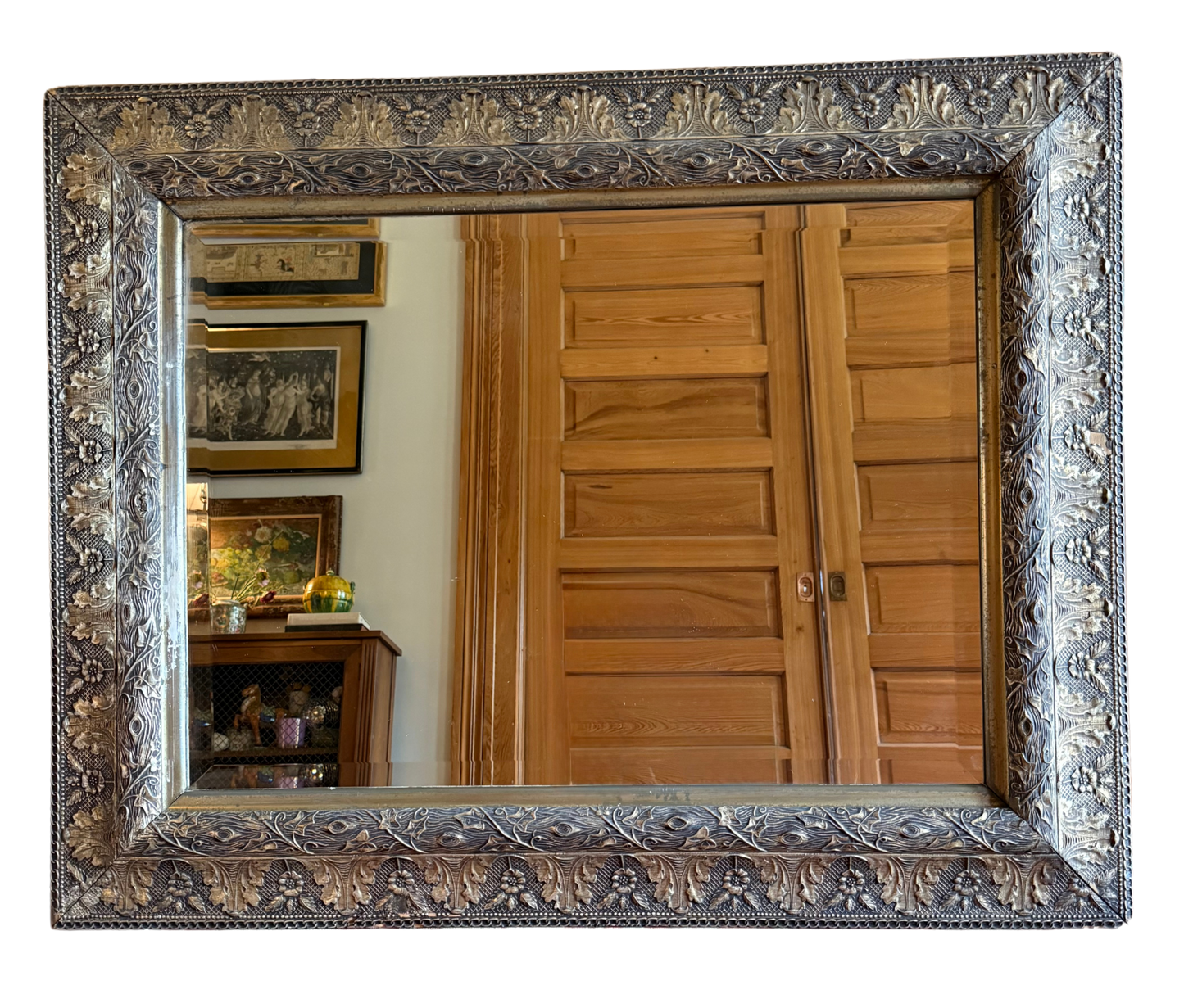 “Antique silver-leaf gilt wood mirror with beveled glass, ornate floral and foliate carved frame, 43 inches wide by 34 inches tall”