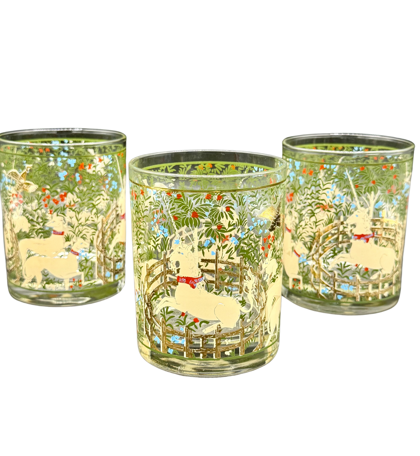 Three Marc Cora enchanted forest tumblers featuring unicorns and floral motif with gold detailing