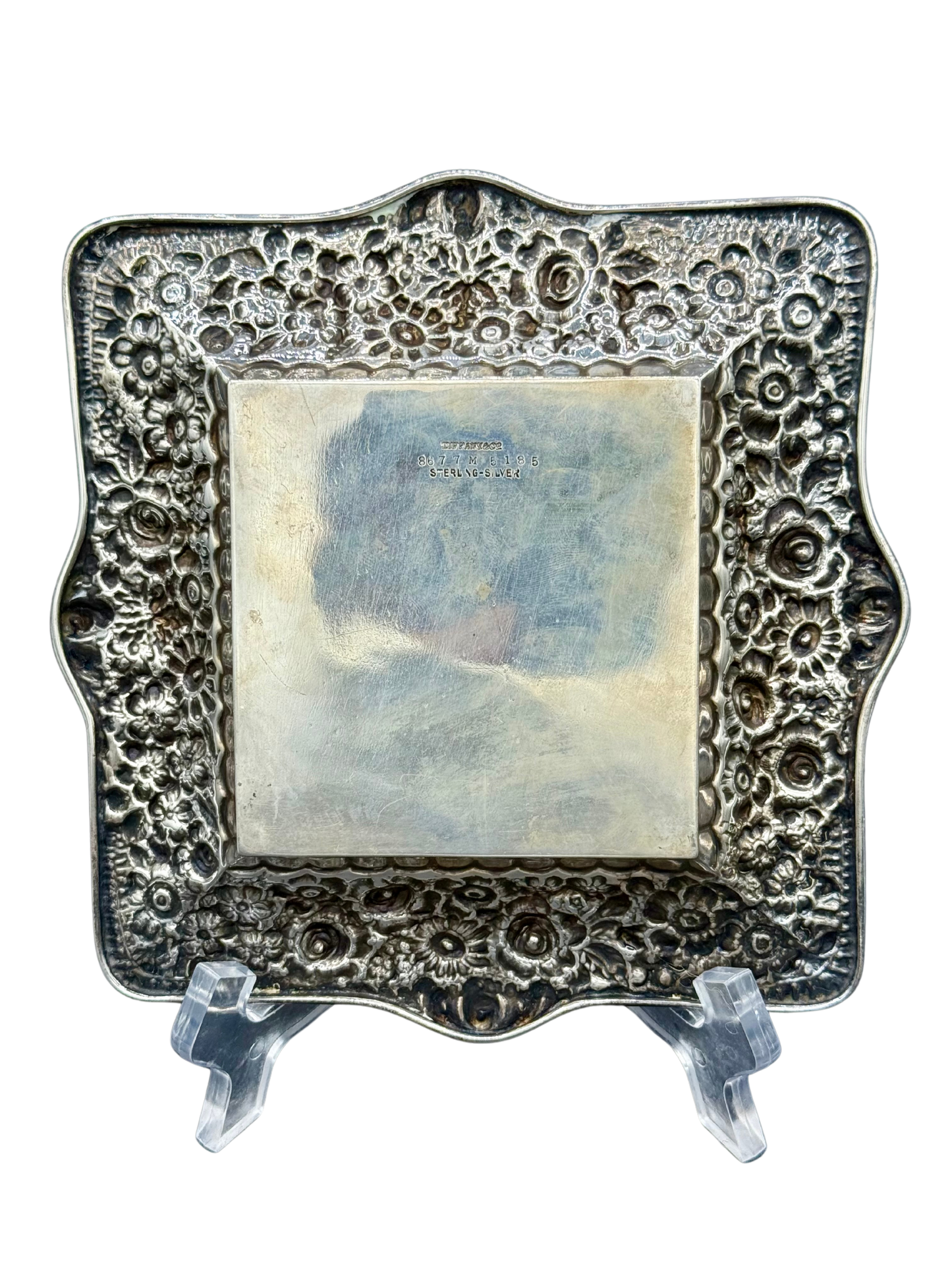 Reverse side of Tiffany & Co. sterling tray showing repoussé floral design and engraved hallmarks