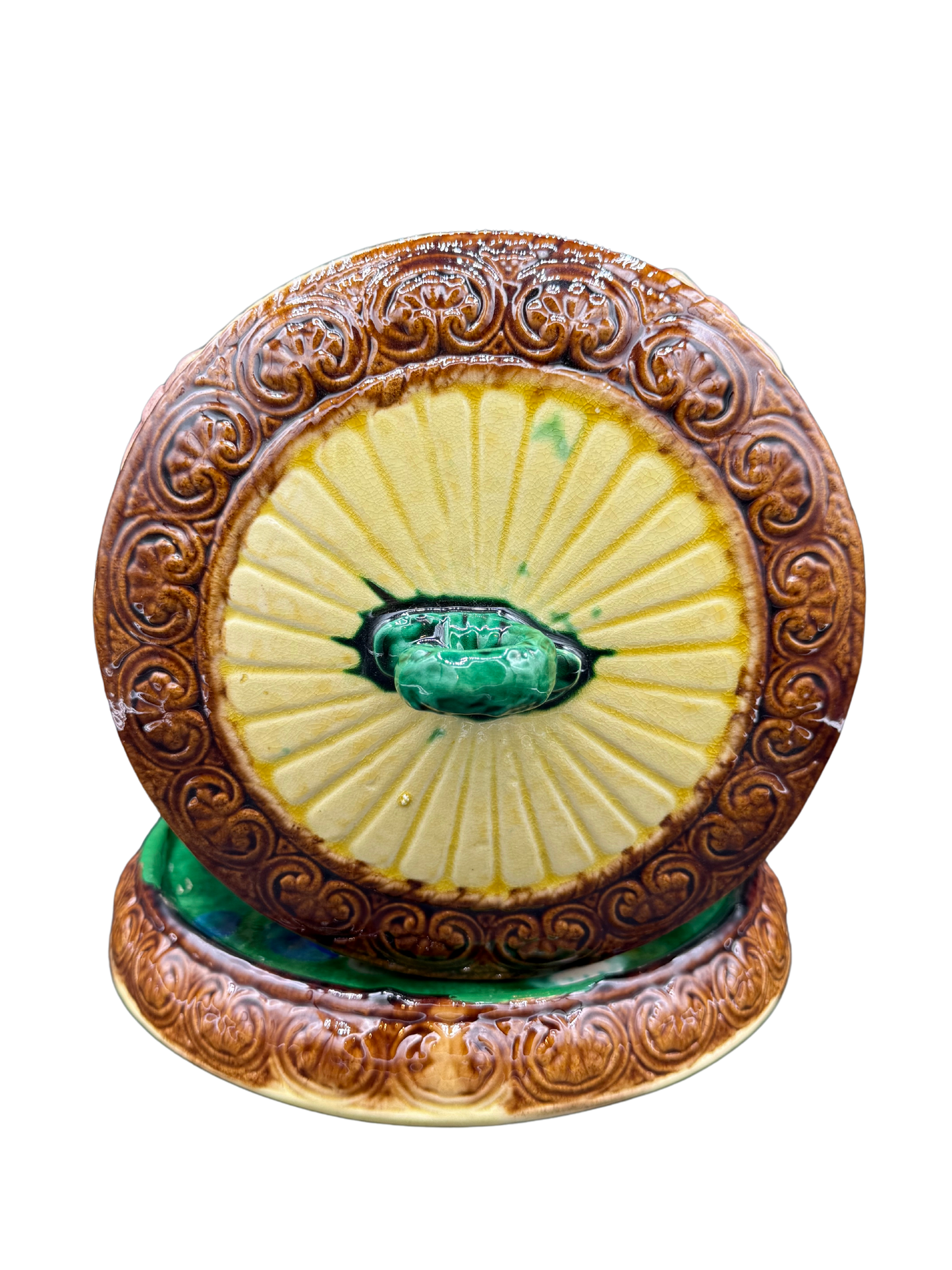 Top view of Victorian ceramic cheese dome lid with sunburst glaze and green finial