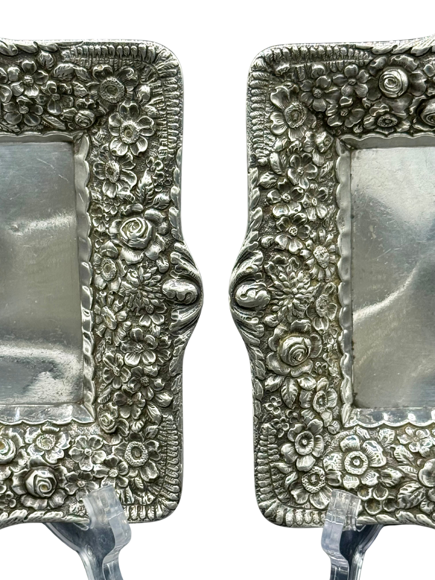 Close-up of raised floral repoussé design on Tiffany sterling silver tray border