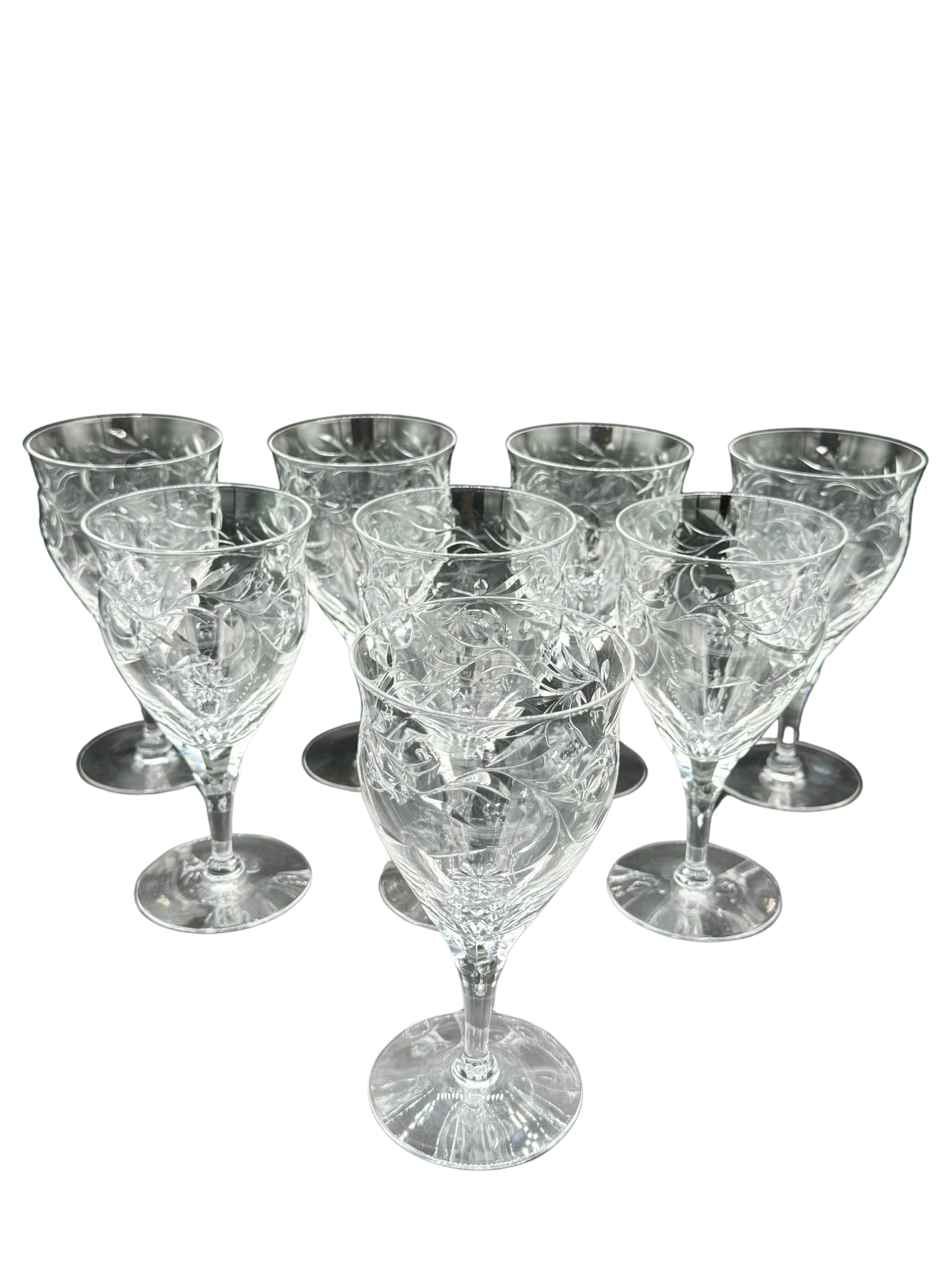 Complete set of 8 vintage Seneca Crystal water goblets with hand-etched floral motif and clear lead crystal brilliance, signed with maker’s mark.