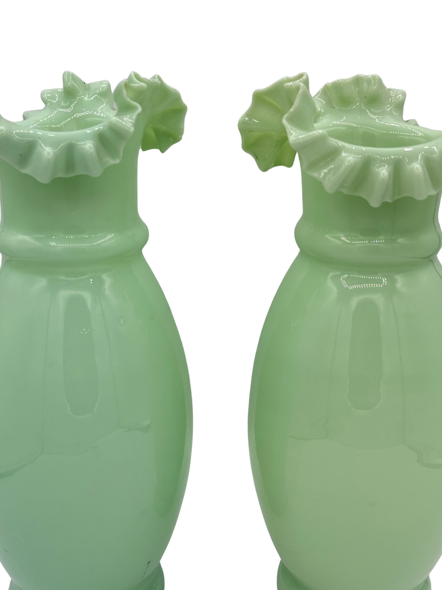 Close-up top view of antique French opaline vase showing ruffled edge and faint traces of worn gilding around the rim.