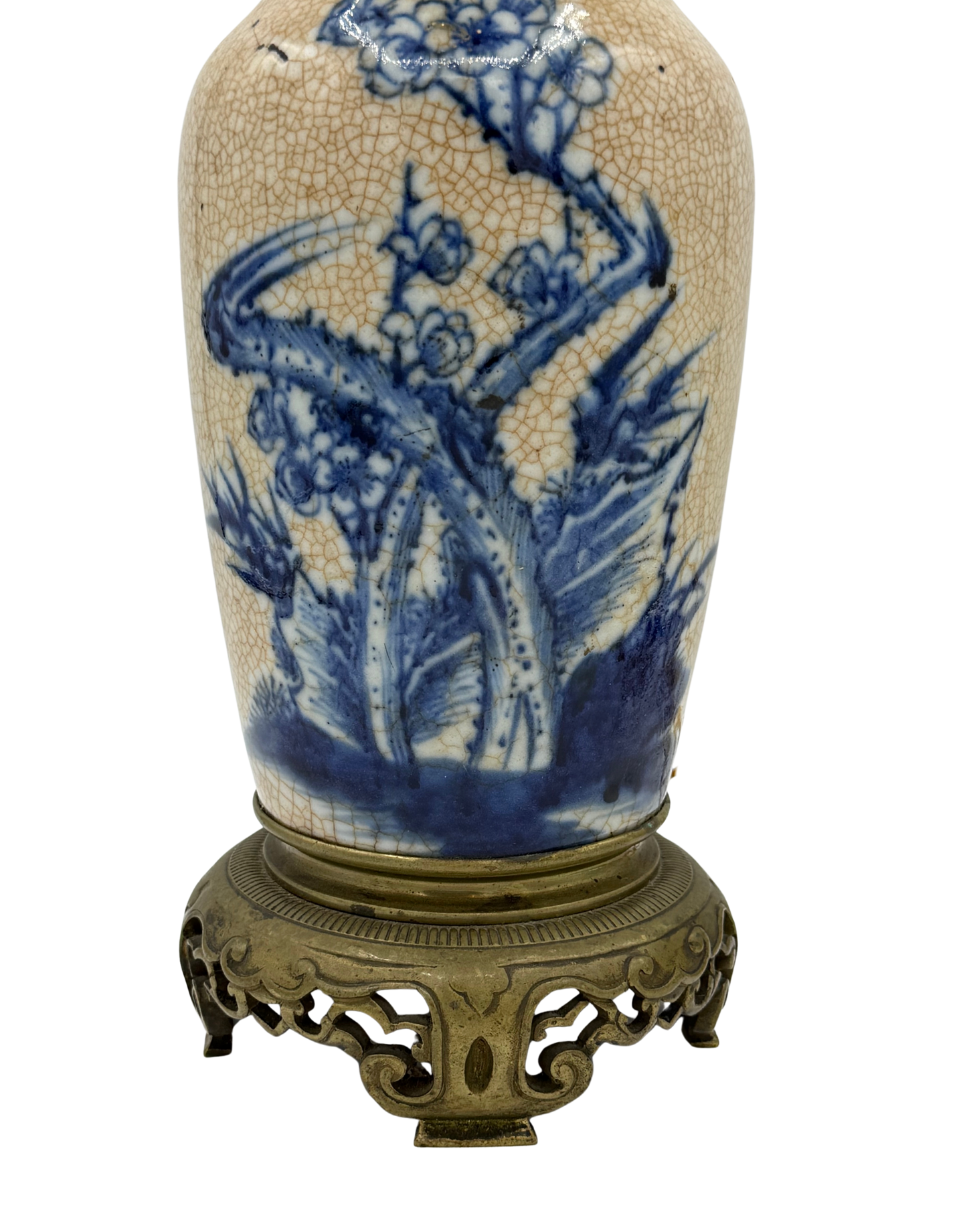 Lower portion of antique French table lamp featuring vibrant blue botanical motifs, crazing, and detailed brass footed base