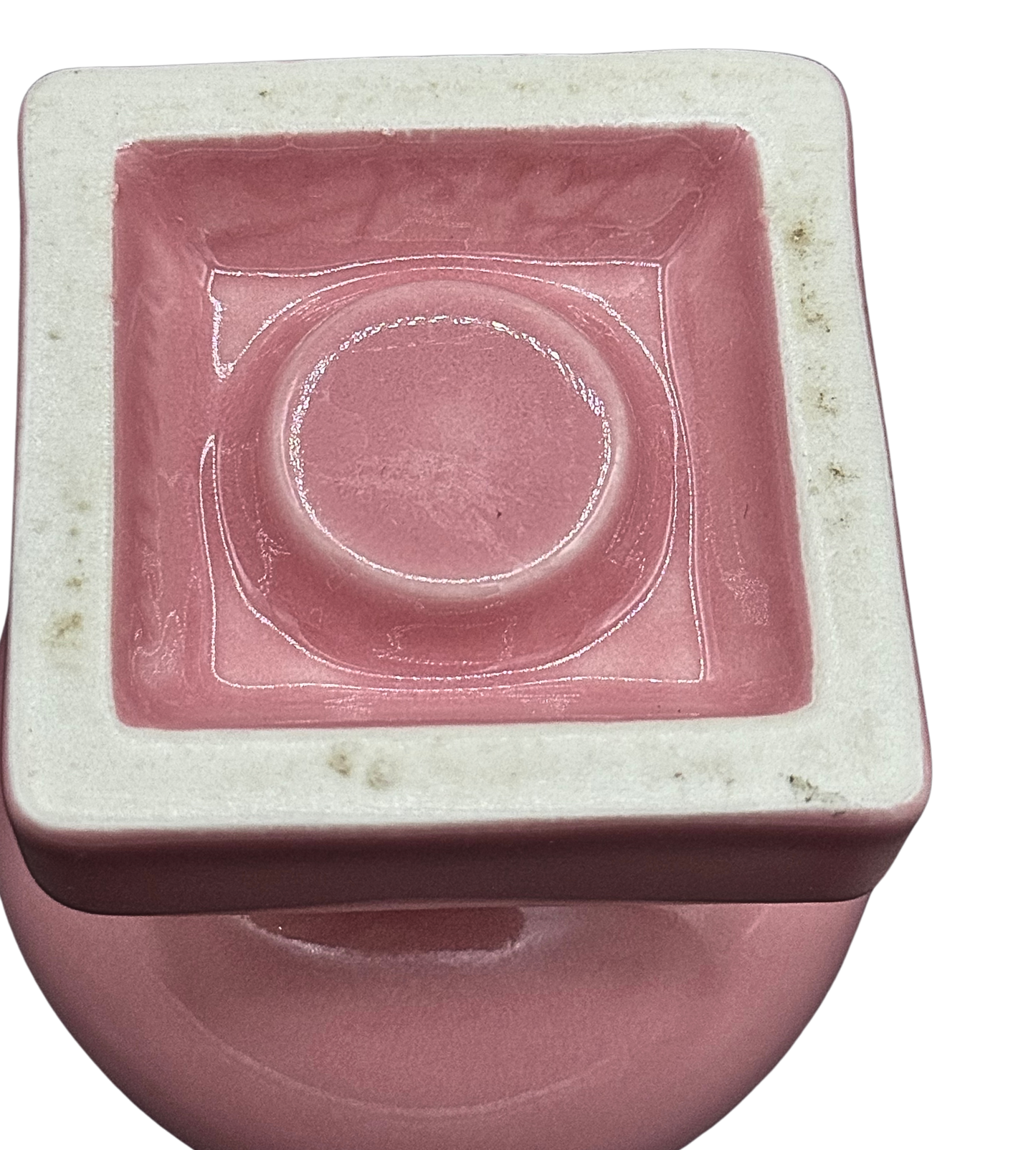 Underside view of vintage Fiestaware pink candle holder, showing marked ceramic base and midcentury glaze detail - marked Fiesta and USA