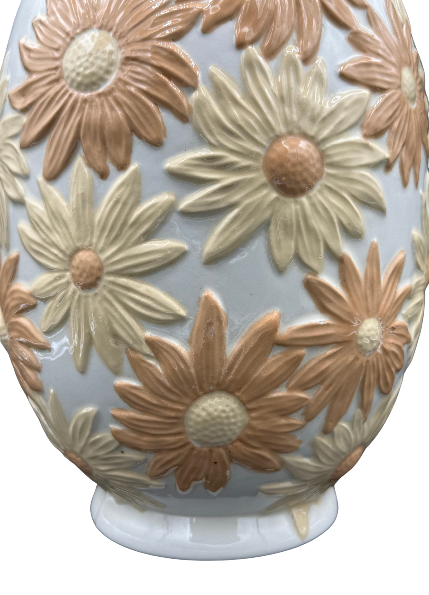 Close-up showing textured glaze and petal detailing on vintage daisy vase.