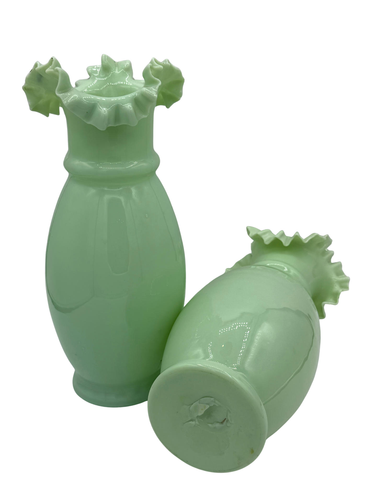 Side angle of vintage pale green opaline vases with fluted edges and subtle variations in color and form, typical of early 20th-century craftsmanship.