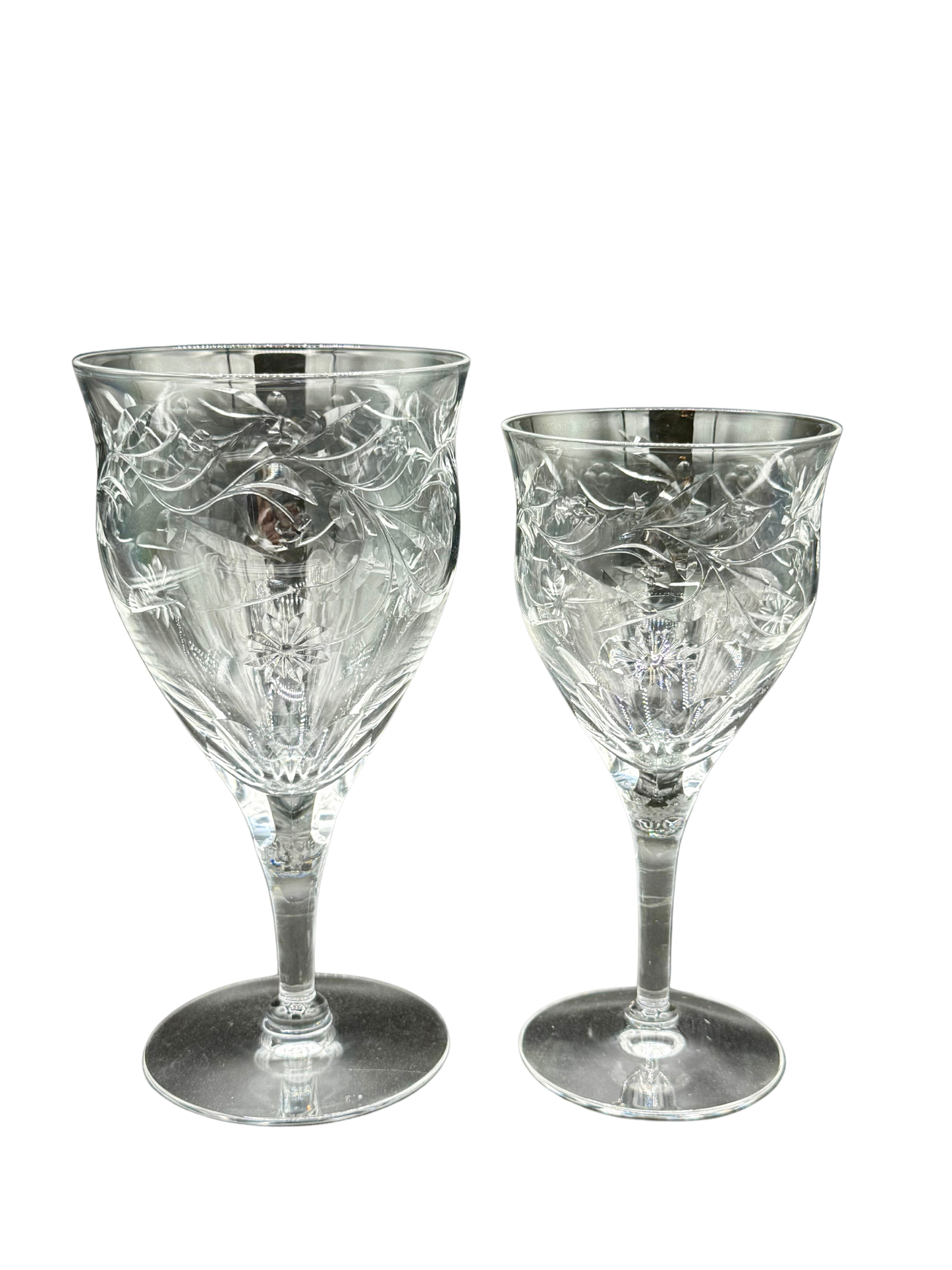 Size comparison of vintage Seneca Crystal goblets – larger water goblet next to red wine glass, both with floral etched design and signature clarity.