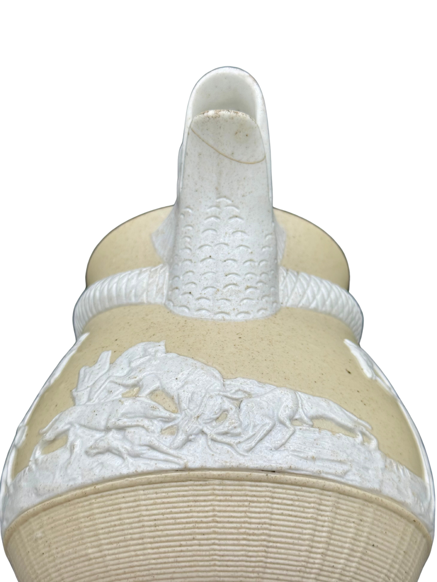 Close-up of dragon spout on 19th-century Stephen Green hunting jug with visible hairline crack
