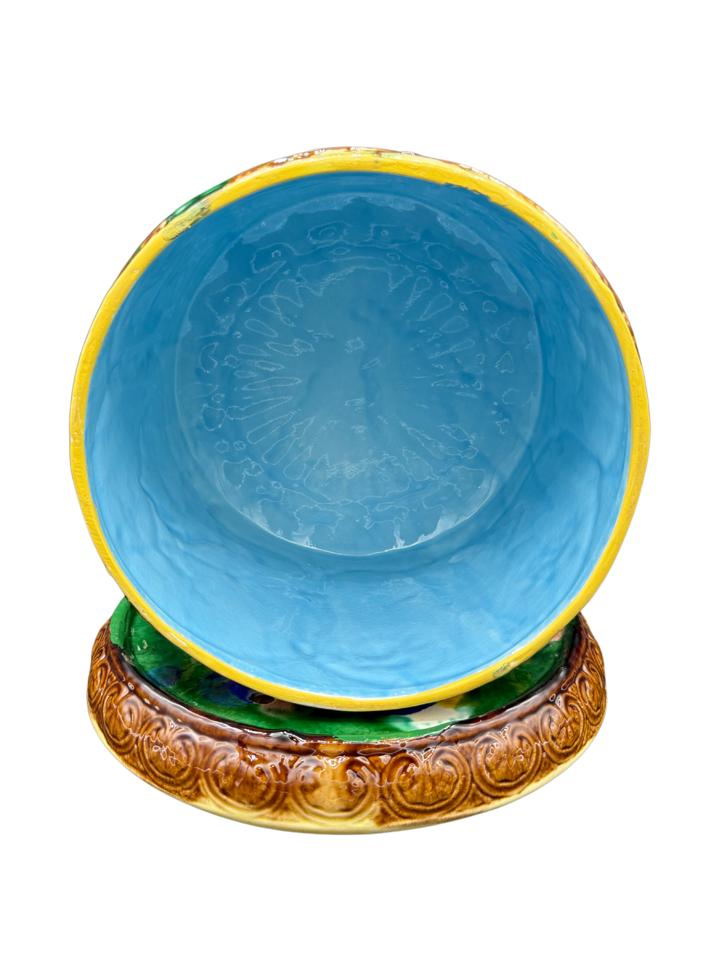 Interior of Victorian majolica cheese keeper showing bright blue glazed ceramic walls