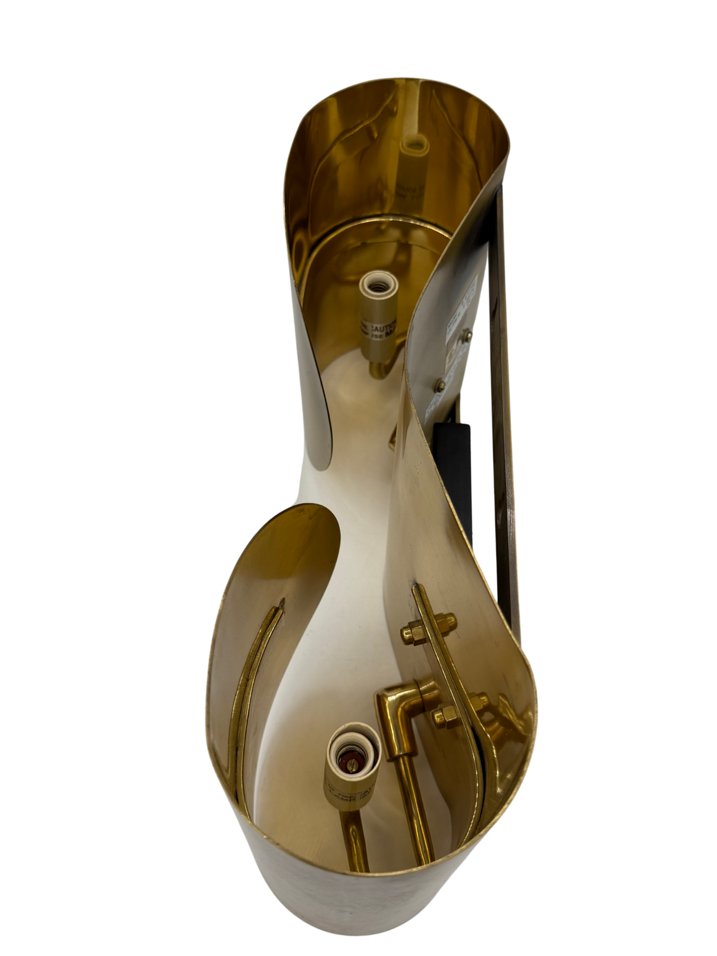 interior detail of vintage brass wall sconce showing dual bulb sockets and original mounting structure, Italian postmodern lighting.