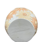 Bottom base of vintage floral vase showing unmarked ceramic surface.
