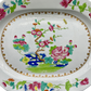 Early 19th century Spode Stone China platter showing central hand-painted garden motif and gold border.