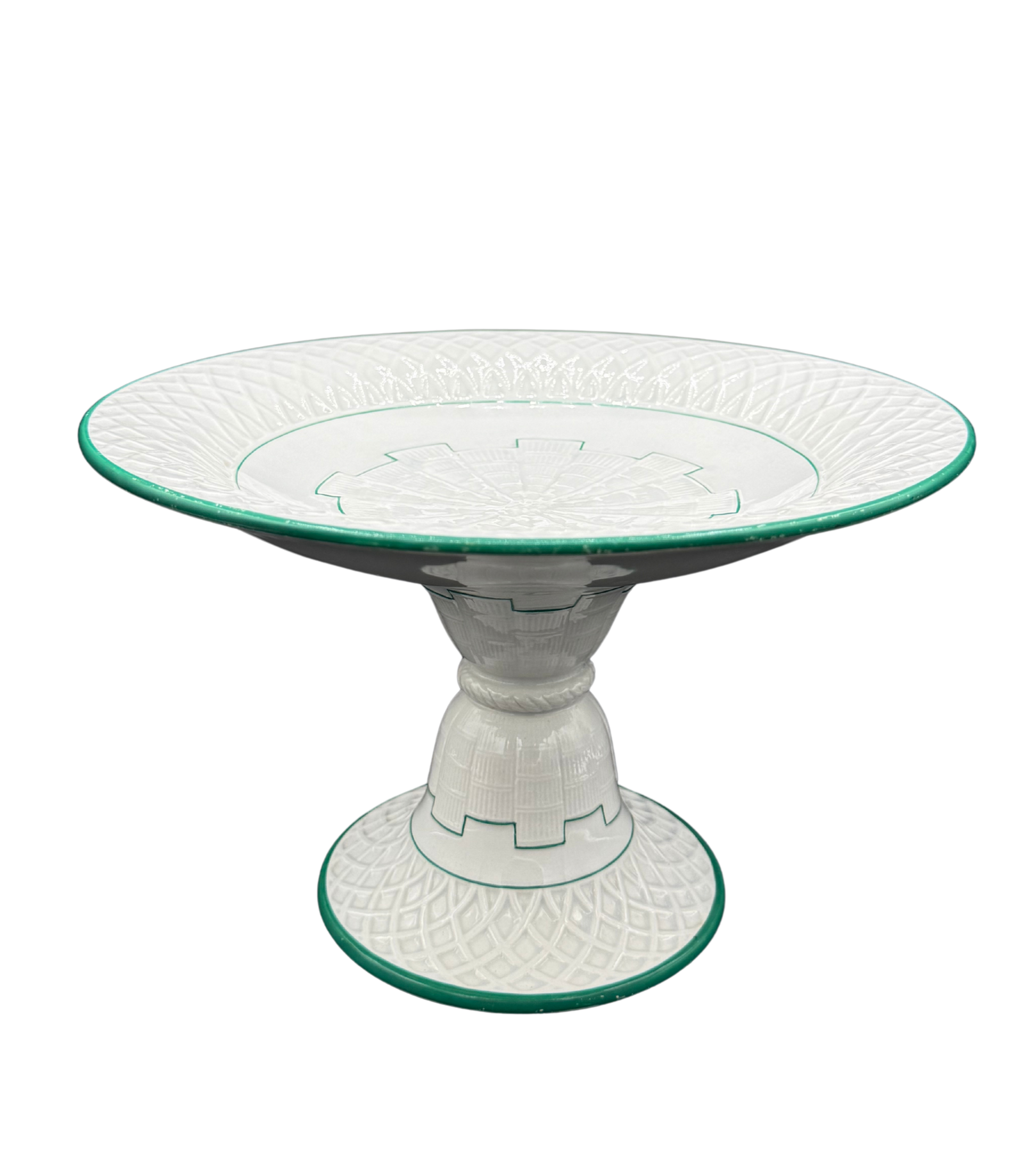 Side angle of Minton green-trimmed ceramic tazza with raised pedestal and molded lattice design