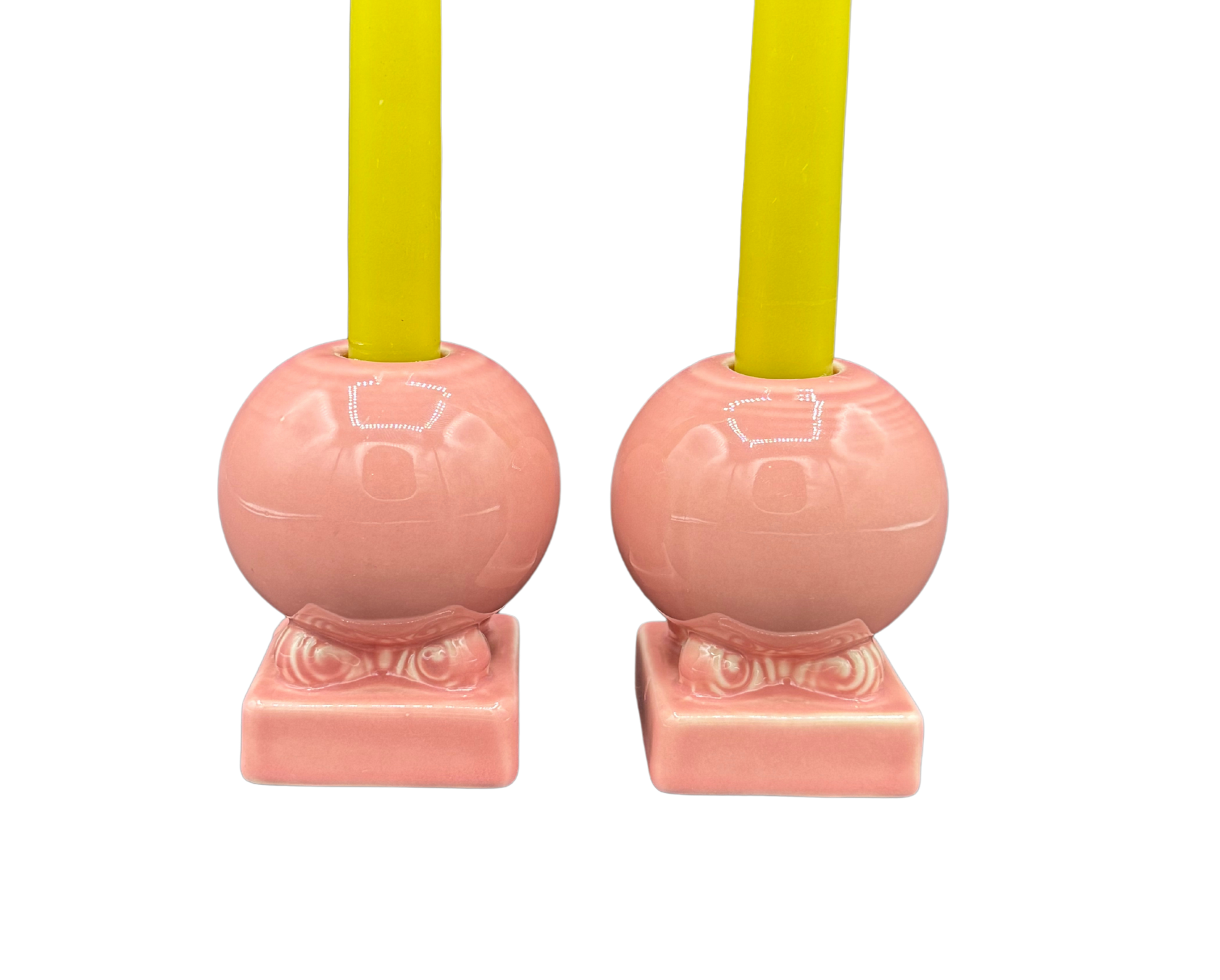 Close-up of Fiestaware pink ceramic globe candle holders, vintage midcentury design