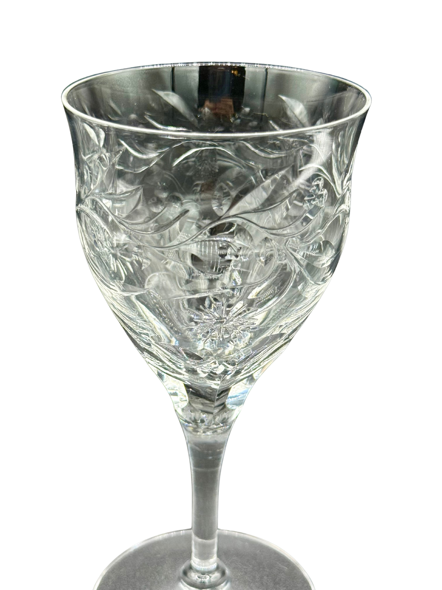 Detailed close-up of etched floral motif on vintage Seneca Crystal wine glass, highlighting hand-cut craftsmanship and brilliant lead crystal clarity.