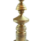  Close-up of geometric midcentury Marbro-style brass lamp with sculpted body, decorative relief band, and warm vintage patina.