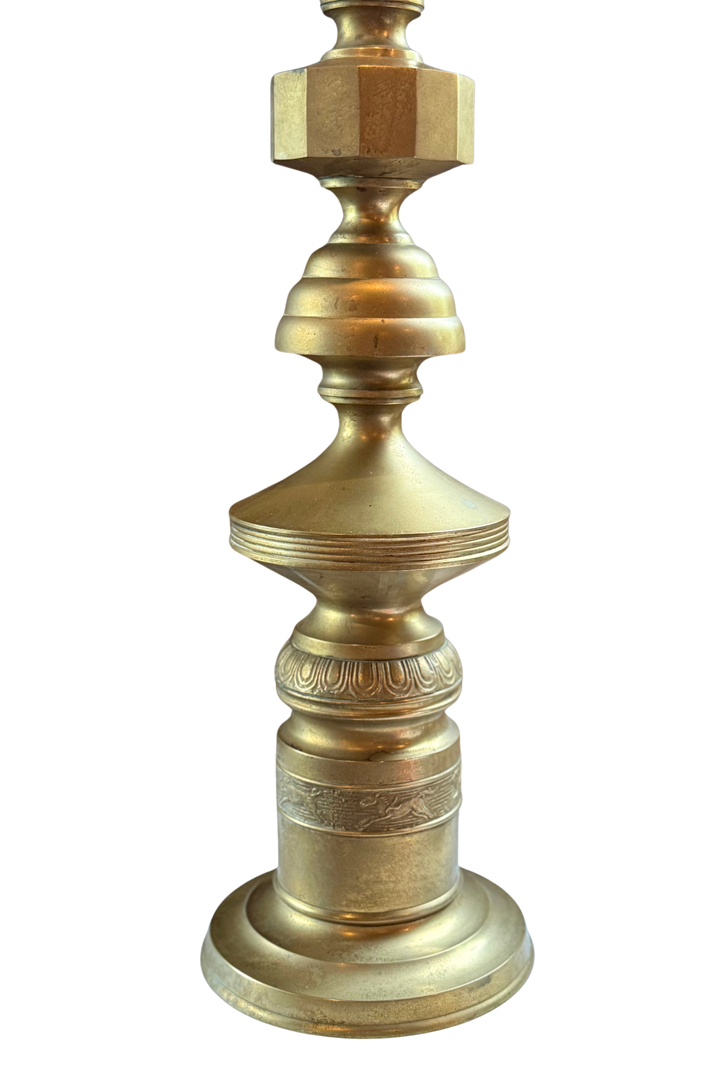  Close-up of geometric midcentury Marbro-style brass lamp with sculpted body, decorative relief band, and warm vintage patina.