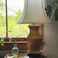 Vintage Morris Greenspan Hollywood Regency lamp with white shade styled on a wood side table near window