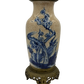 Antique French chinoiserie-style table lamp with blue underglaze floral painting, heavy crackle glaze, and ornate brass base.