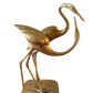 Vintage brass crane sculpture with two birds, mid-century style, rich patina, front view