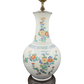 Front view of vintage ceramic table lamp with colorful hand-painted floral design and wooden base