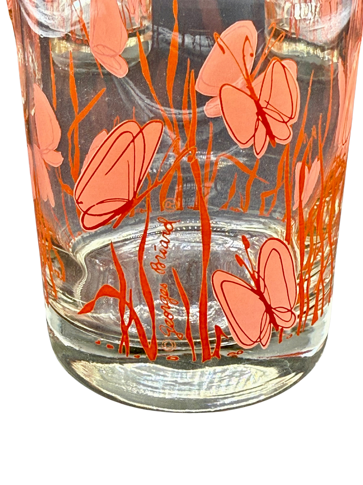 Signature detail on Georges Briard vintage tumbler with pink butterflies in orange grass