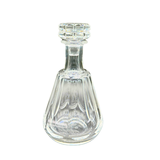 Straight-on view of Baccarat French crystal decanter with bold vertical panel cuts and faceted stopper, Talleyrand pattern