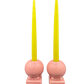 Pair of vintage Fiestaware pink candle holders with yellow tapers, midcentury ceramic home decor