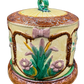 Side of Victorian cheese keeper with pink bow and iris motif in raised majolica glaze