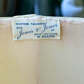 Label on a beige fabric with 'Jones & Jones of New Orleans by Diane' text
