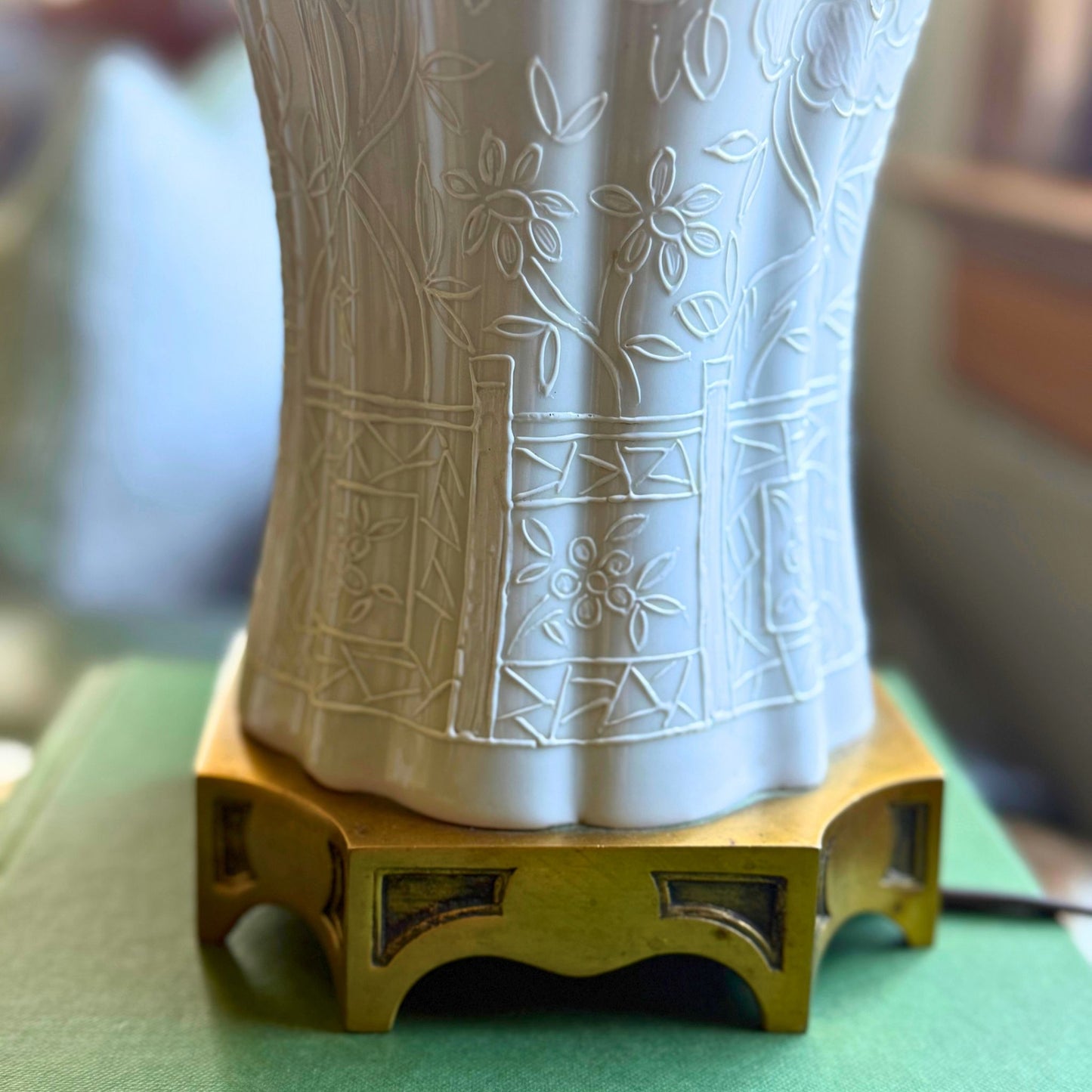 Decorative vase with intricate patterns on a gold stand