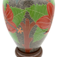 Rear view of carved stoneware lamp showing floral and tree motifs in red and green against black wave background