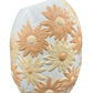 Side view of large vintage floral ceramic vase with raised daisy pattern and asymmetrical rim.
