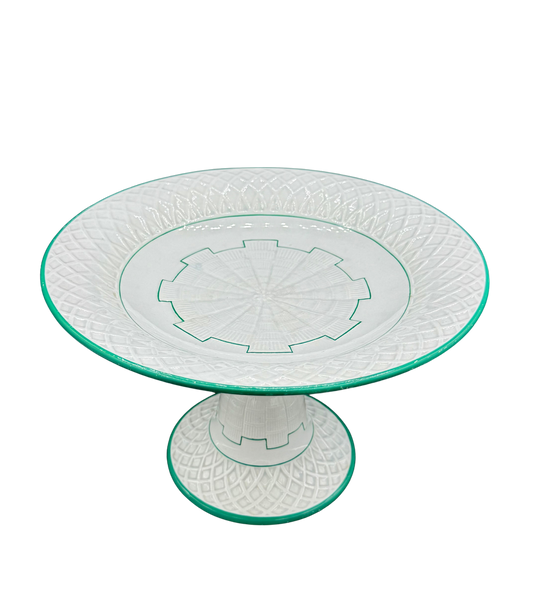 Antique Minton pedestal tazza with green enamel trim and basketweave relief, c. 1873, on black background
