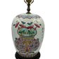 Hand-painted Chinese porcelain ginger jar lamp from the early 20th century featuring peonies in a geometric vase, Famille Rose palette, and original lid