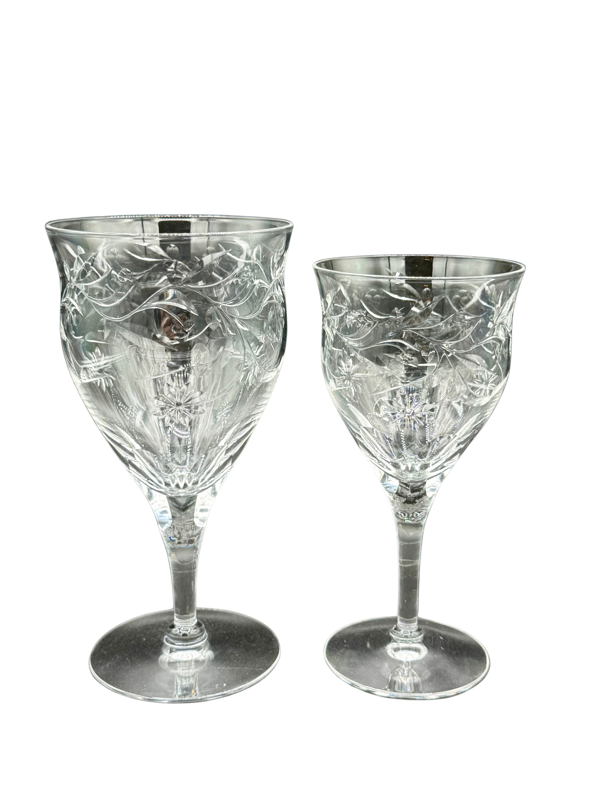 Size comparison of vintage Seneca Crystal goblets – larger water goblet next to red wine glass, both with floral etched design and signature clarity.