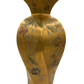 Close-up of hand-painted floral motifs on gold porcelain Greenspan lamp with curved, sculptural form