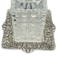 Detailed view of Tiffany repoussé sterling tray with cut crystal decanter base, highlighting floral border