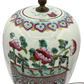 Close-up of Chinese ginger jar lamp with enamel-style glaze, original lid, Greek key and ribbon collar, and Famille Rose peony basket design
