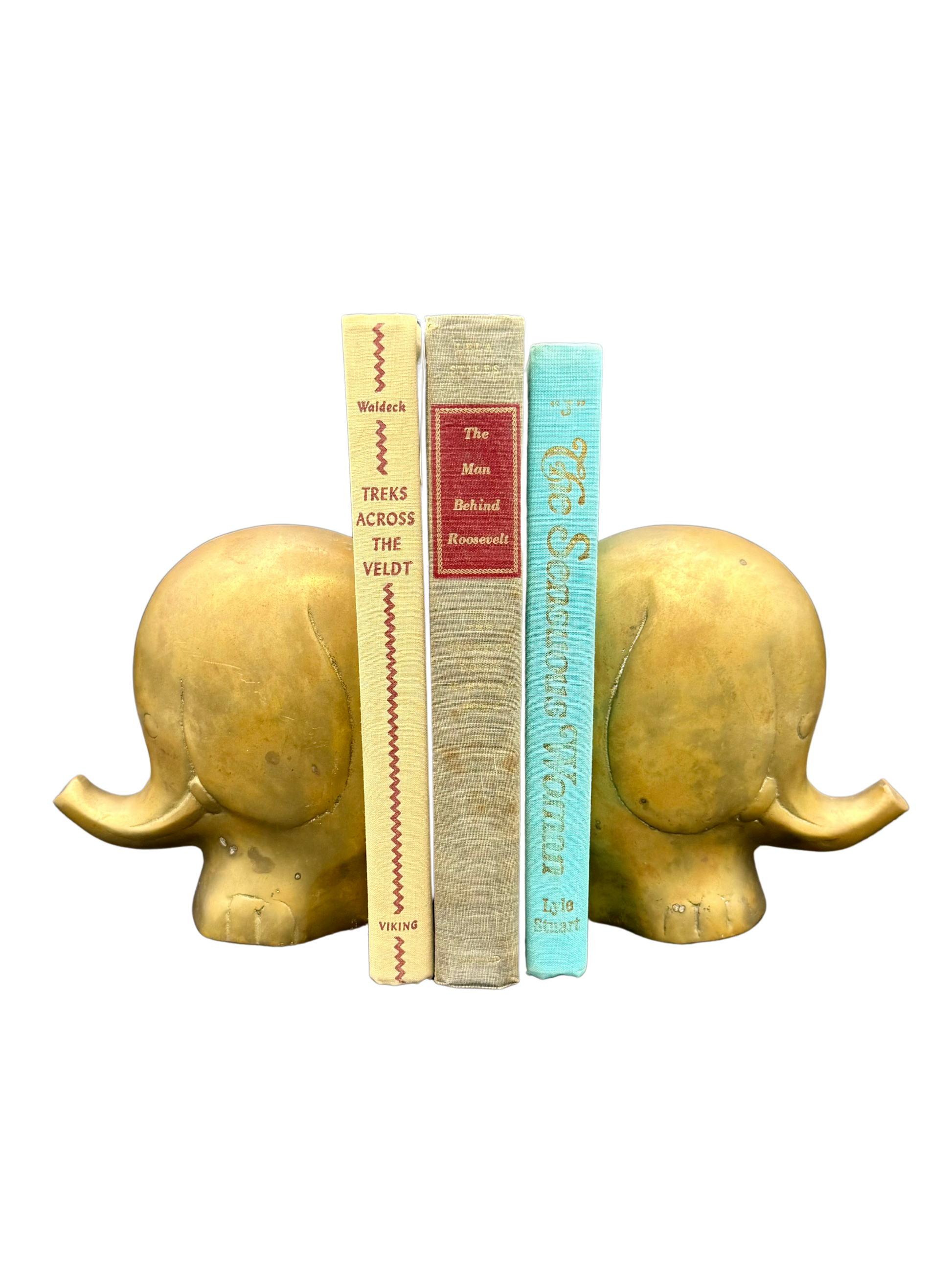 Vintage brass elephant bookends with mid-century modern books, Luigi Colani style