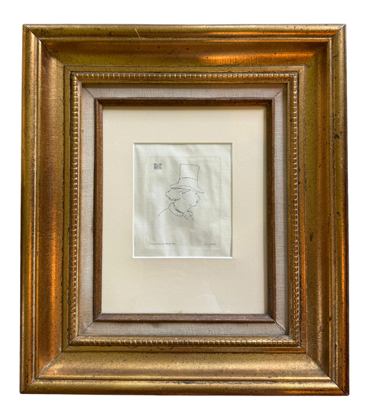 Framed 1862 etching by Édouard Manet titled "Baudelaire With Hat," displayed on a wall in a gold gilt frame with linen matting.